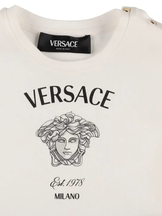 Versace   Printed logo cotton jersey dress 